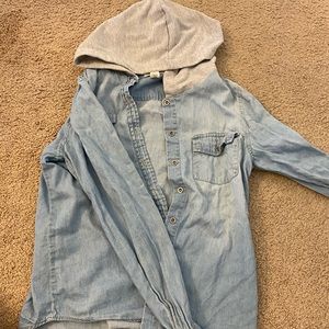 Thin blue jean jacket with gray hoodie and pocket